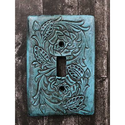 These Western turquoise tooled floral blossoms wall electrical cover plates. They fit standard wall receptacles. Each plate weighs about 5 ounces. | Ebros Gift Tooled Scrollwork 1-Gang Toggle Light Switch Wall Plate in Blue / Green | 5.25 H x 3.5 W x 0.5 D in | Wayfair Clay Name Plates For Home, Ceramic Light Switch, Decorative Light Switch Covers, Clay Inspo, Turquoise Walls, Beautiful Bedrooms Master, Western Turquoise, House Vibes, Concrete Candle