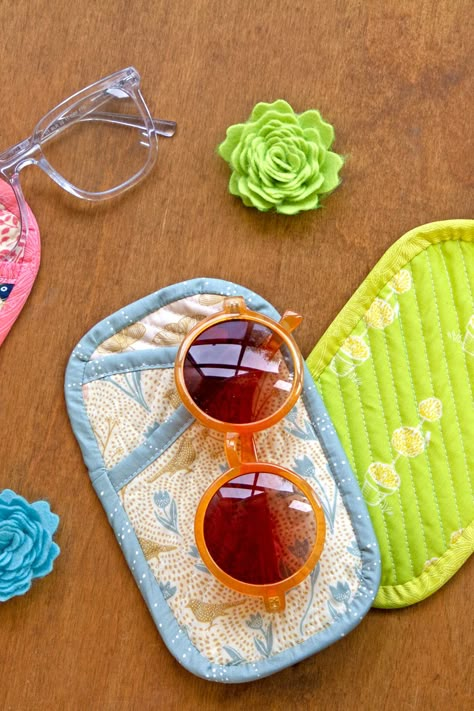 Keep your favorite pair of sunglasses safe and stylish with our Sunny Glasses Case! Crafted with love using prints from Katie O'Shea's Spring Equinox Collection, this case is both pretty and practical, ensuring your sunglasses stay scratch-free in your bag while on the go. Download the pattern and prepare for exciting outdoor adventures with this must-have accessory for sunny days ahead! #ArtGalleryFabrics #Quilting #DIYProjects #FabricCrafts #SewingProjects Sewing Sunglasses Case, Quilted Sunglasses Case, Quilted Glasses Case, Sunglasses Case Sewing Pattern, Glasses Case Sewing Pattern, Sunny Glasses, Diy Fabric Crafts, Crafts Sewing Patterns, Sew Simple