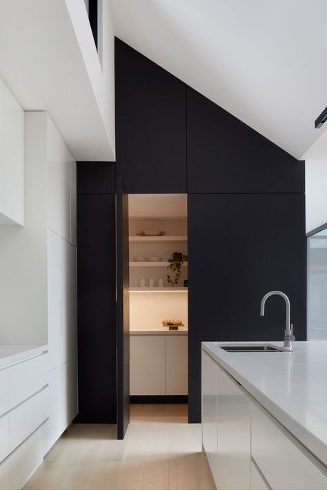 modern kitchen pantry idea for renovated home in Thornbury, Melbourne. Designed by C.Kairouz Architects. Hidden Kitchen Pantry, Hidden Butlers Pantry, Featured Wall, Pantry Lighting, Kitchen Butlers Pantry, Modern Pantry, Pitched Ceiling, Raked Ceiling, Black Feature Wall