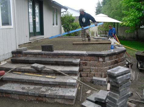 Raised Concrete Deck, Raised Patio Ideas With Steps, Raised Stone Patio, Raised Concrete Patio, Deck To Patio Transition, Stone Paver Patio, Concrete Decks, Patio Plan, Stone Deck