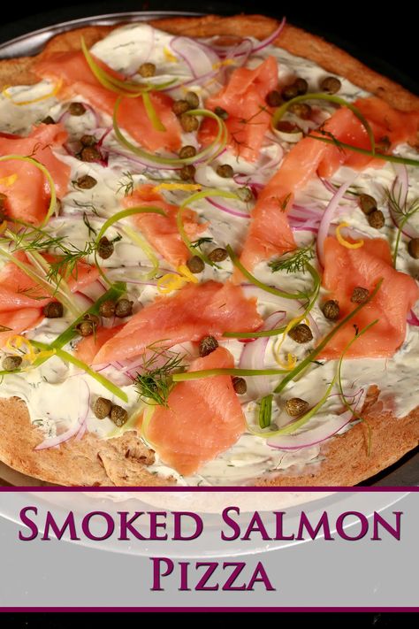 A close up view of smoked salmon pizza. The crust is rye, and it's topped with cream cheese sauce, smoked salmon, and other toppings. Smoked Salmon Pizza Recipe, Salmon Pizza Recipe, Salmon Flatbread Pizza, Smoked Salmon Flatbread, Gourmet Pizza Toppings, Pizza Topping Ideas, Salmon Flatbread, Cream Cheese Pizza, Naan Pizzas