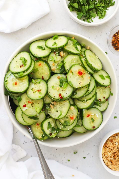 This Thai-style cucumber salad recipe is fresh, light, and the perfect easy side dish for chicken satay, curry, summer BBQs, and more! Cool, crisp cucumbers get tossed in a tangy Thai dressing to make a delicious side dish you can enjoy any time. Get the recipe for this Asian cucumber salad and more side dish recipes to try at One Lovely Life Thai Side Dishes, Satay Curry, Thai Dressing, Thai Cucumber Salad, Asian Cucumber Salad, Cucumber Salad Recipe, Side Dishes For Chicken, Cucumber Recipes Salad, Chicken Satay