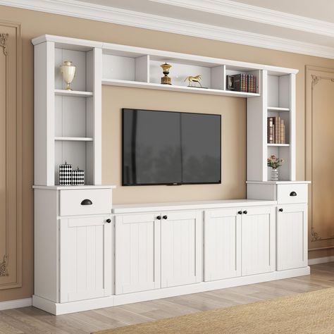 PRICES MAY VARY. [All in One TV Stand]: The modern TV cabinet wall unit is suitable for TVs up to 75 inches and comes with 4 sections. Integrate a TV cabinet, bookshelf, and wine cabinet into one to create a personalized storage living room. [Large Storage Space]: This wall unit TV cabinet features a stylish shape and color scheme that perfectly blends into any room style. There are 9 open shelves, 2 drawers and 4 cabinets with adjustable shelves to easily store audio and video equipment. [High Small Built In Tv Wall Unit, Tv Wall Design With Storage, Small Entertainment Center Ideas, Tv In Cabinet, Tv Storage Ideas, Entertainment Center Decor Living Room, Model Homes Interiors Photo Galleries, Tv Framed On Wall, Living Room Designs Tv Wall