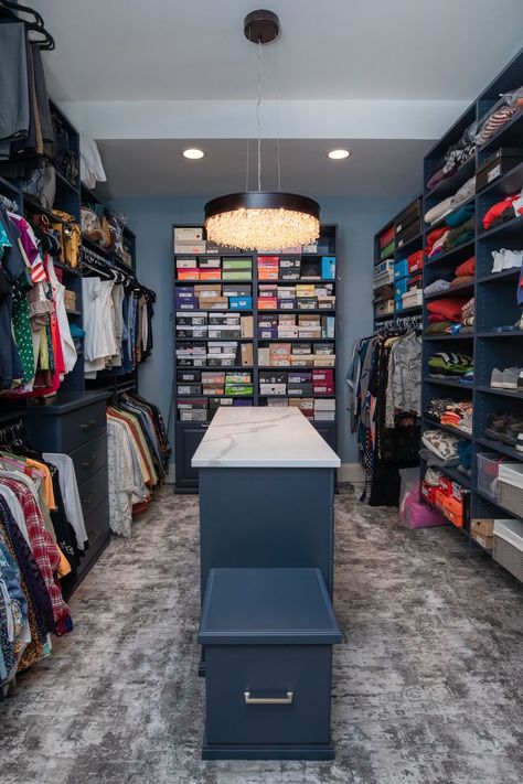 The newly designed closet has custom navy-blue shelves, and the island countertop matches the bathroom countertops of Mont Calcutta NY quartz.  Customized laundry bins, specialized drawers and shelves were added to the ceiling. The carpet is soft and silky and a dream to walk on in your bare feet.  Our homeowners love the aesthetics and customized functional spaces of their luxurious new Navy Blue Closet, Blue Closet, Luxury Master Bath, Corner Built In, Laundry Bins, Master Suite Bathroom, Island Countertop, Blue Shelves, Built In Bathtub