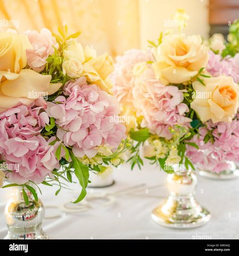 Download this stock image: Still life with a wedding bouquet of flowers. Pink hydrangeas and yellow rose on table. Close up - MB5AGJ from Alamy's library of millions of high resolution stock photos, illustrations and vectors. Light Pink And Yellow Wedding Flowers, Yellow And Pink Themed Party, Pink And Yellow Roses Arrangement, Pastel Pink And Yellow Wedding Theme, Light Pink And Yellow Wedding, Pink Yellow Flower Arrangement, Yellow And Pink Wedding, Wedding Bouquet Of Flowers, Pink Yellow Weddings