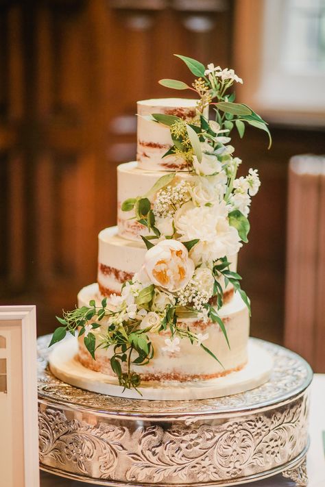 Semi Naked 4 tier wedding cake at Jesmond Dene House in Newcastle, by Dreamworld Cakes, adorned with a garland of white & green fresh flowers and foliage such as Peony, Jasmine and Eucalyptus. Image by Helen Russell Semi Naked Wedding Cake With Flowers, Wedding Cake Foliage, Wedding Cake Spring Flowers, Wedding Cake Flowers Cascade, Botanical Wedding Cake, Wedding Cake With Fresh Flowers, Semi Naked Wedding Cake, Jesmond Dene, Kingscote Barn