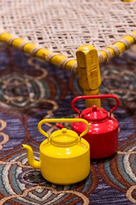 Photo of Red and yellow tea kettles in decor Wedding Decor Themes, Resturant Design, Trending Images, Tea Restaurant, Decoration Theme, Outdoor Restaurant Design, Restaurant Exterior, Coffee Shop Interior Design, Food Cart Design