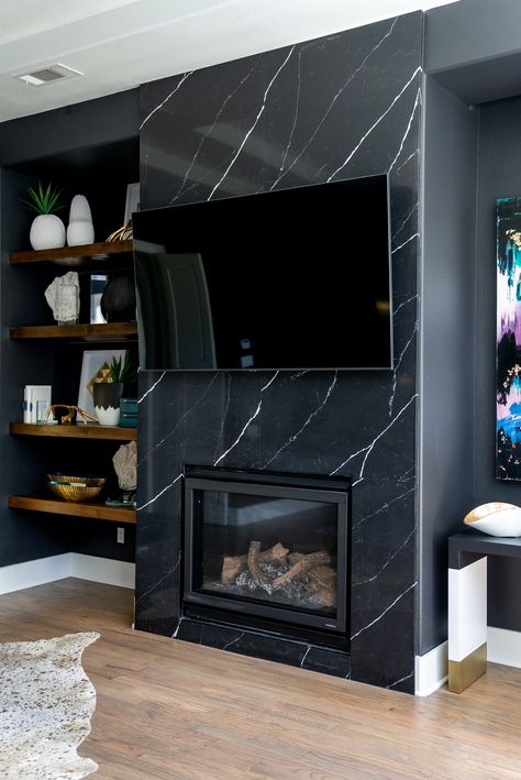 Sleek black marble and floating wooden shelves add modern sophistication to this cozy bedroom fireplace. The perfect blend of elegance and warmth for a luxurious retreat.

Modern bedroom design, bedroom fireplace, black marble, floating shelves, luxury bedroom decor, high-end bedroom, cozy retreat Modern Bedroom Fireplace, Fireplace Black Marble, Cozy Bedroom Fireplace, Bedroom Floating Shelves, Floating Wooden Shelves, Transitional Glam, Fireplace Black, Styling Shelves, Black Fireplace