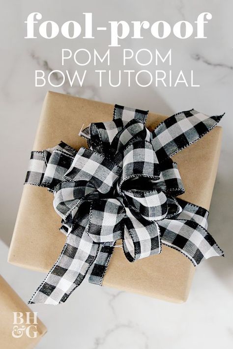 Whether you're wrapping Christmas gifts for the family or embellishing a birthday package, we'll show you how to make a pom pom bow. This might be the easiest bow you've ever made. #howtomakeabowwithribbon #giftwrapping #pompombow #bowforagift #christmas #bhg Diy Bow With Wired Ribbon, Wire Edged Ribbon Bow Diy, How To Make A Pom Pom Bow, Wire Bows Diy, Pom Pom Bows Diy, How To Make A Bow With Wired Ribbon Diy, How To Make A Wire Ribbon Bow, Easiest Way To Make A Bow, Diy Gift Bow Ribbon