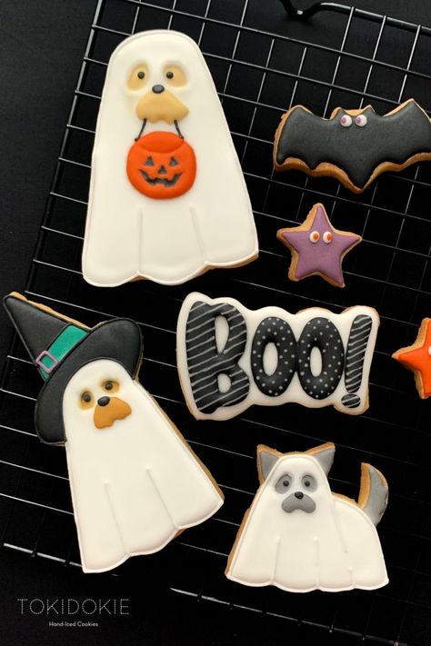 Halloween decorated sugar cookies. Dog shaped cookies. Cookies Decorated Halloween, Halloween Decorations Cookies, Decorated Cookies Halloween, Easy Halloween Cookies Decorated, Cookie Sets Decorated, Cookie Designs Halloween, Spooky Halloween Cookies Decorated, Halloween Dog Cookies, Boo Cookies