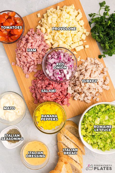 This easy Hoagie Dip takes everything you love about an authentic Italian hoagie and turns it into delicious dip form. All the deli meat and cheeses chopped and tossed with a creamy Italian dressing and scooped up with crusty baguette slices. Skip the sub shop and make this at home for a new favorite! | www.persnicketyplates.com Deli Meat Meal Prep, Italian Chopped Salad Subs, Deli Meat Recipes Healthy, Italian Chop Sandwich, Hoagie Chopped Salad, Easy Hoagie Sandwiches, Chopped Hoagie Sandwich, Chopped Italian Sandwich Wrap, Chopped Sandwich Salad