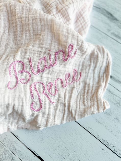 Sew Swaddle Blanket, How To Sew Muslin Blanket, How To Embroider Letters With Yarn, Hand Embroidered Baby Blankets, Swaddle Embroidery, Embroidered Muslin Blanket, Embroidered Swaddle Blanket, How To Hand Embroidery Letters, Knit Sweater Tutorial