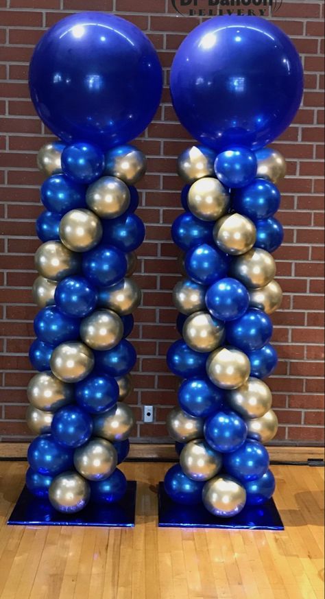 Blue And Gold Balloons Decoration, Graduation Balloon Decorations Outside, Balloon Columns Graduation, Graduation Balloon Columns Ideas, Blue And Gold Table Centerpieces, Blue And Silver Graduation Party Ideas, Blue And Gold Decorations Party, Blue And Gold Balloon Arch, Blue And Gold Graduation Party Ideas