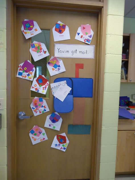 Post office themed bulletin board on the classroom door.  We like to make use of all of out space to create bulletin boards out of the children's art. Post Office Bulletin Board Ideas, Classroom Post Office, Post Office Math Activities Preschool, Community Helpers Week Preschool, Post Office Crafts For Toddlers, Post Office Art Preschool, Post Office Preschool Crafts, Post Office Theme Preschool, Post Office Activities For Toddlers