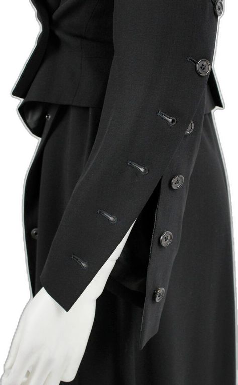 Ann Demeulemeester black jacket with buttons twisting around the sleeves — fall 2010 - V A N II T A S Button Detail Fashion, Ann Demeulemeester Jacket, Feminine Streetwear, Fashion Archive, Utilitarian Style, Archive Fashion, Clothing Details, Dress Coat, Mood Board Fashion