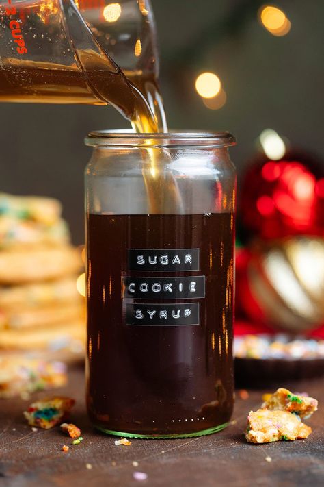 This festive Sugar Cookie Syrup tastes just like sugar cookies and it's perfect for lattes, cocktails, mocktails, and more! It's ready in just 15 minutes and calls for just 5 ingredients. This delicious sugar cookie coffee syrup is perfect for Christmas but you can make it any time of the year. It's a great Starbucks copycat recipe, better than any store-bought syrup, and freezer-friendly! Starbucks Sugar Cookie Syrup, Sugar Cookie Coffee, Starbucks Sugar Cookie, Sugar Cookie Syrup, Green Beans With Cranberries, Diy Sugar Cookies, Syrup For Coffee, Balsamic Brussels Sprouts, Thyme Simple Syrup