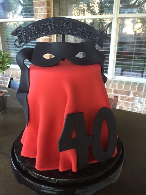 Keep calm - 40 is only "mostly dead."  Princess Bride theme for a 40th birthday surprise party.  Cake by Michelle's Patisserie in Cedar Park, TX.  Layers alternate between chocolate and vanilla with a red fondant 'Buttercup's Dress' draping and black 'Dread Pirate Roberts' mask.  'mostly dead' cake topper. Princess Bride Decorations, Princess Bride Cake, Princess Bride Birthday Party, The Princess Bride Party, Princess Bride Cookbook, Dread Pirate Roberts, Bride Birthday, Black Dreads, Brides Cake