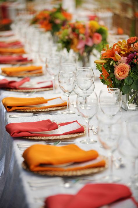 Orange And White Table Setting, Orange And Red Wedding Theme, Pink And Orange Tablescape, Orange Napkins Wedding, Pink And Orange Table Setting, Orange And Yellow Party, Pink Orange Yellow Wedding, Sunset Themed Wedding, Red And Orange Wedding