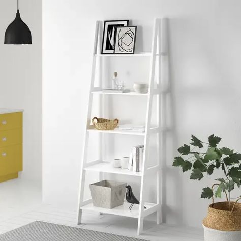 Natrona 72.5'' H x 25.25'' W Solid Wood Ladder Bookcase | This ladder bookcase is simple and fits in with a variety of decor styles. If you are lacking in something of interest in the background of your screen add a shelf and then choose a few items to decorate it (suggestions as follows). You can also use the lower shelves for storage since your client probably won’t see them. Ladder Shelf Ikea, Style Bookshelf, Bookcase Wood, Wood Wall Bathroom, Wall Mounted Bathroom Cabinets, Ladder Bookshelf, Framed Photos, Wood Ladder, Solid Wood Shelves