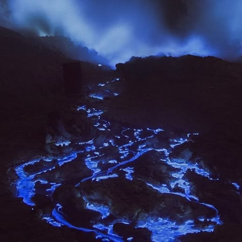 blue lava at kawah ijen volcano, indonesia. the phenomenon occurs when sulfur burns. the reaction produces an electric-blue flame that has the illusory appearance of lava 🌋 Ijen Volcano, Kawah Ijen, Blue Lava, 7 Continents, Fantasy Story, Blue Flames, Land Art, Volcano, Travel Around The World