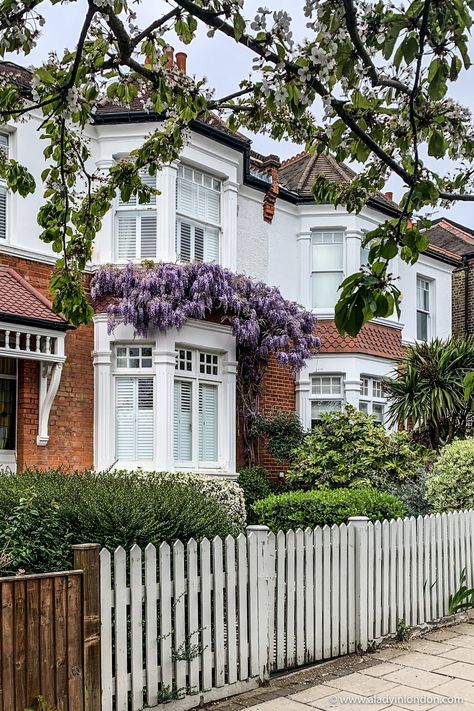 This wisteria house in London, England is one of the prettiest homes in Dulwich, London. This window on a brick house exterior is pretty with the wisteria over it. The London wisteria is legendary and seeing wisteria in London is one of the best things to do in London in spring. #wisteria #london #dulwich #house #windowsanddoors #spring #springflowers #flowers Wisteria On House, Victorian House Exterior Uk, Victorian Terrace House Exterior, Red Victorian House, London Wisteria, London House Exterior, Spring Wisteria, Edwardian House Exterior, Wisteria London