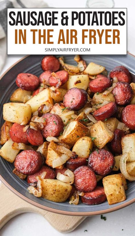 cooked pieces of sausage, potatoes and onions in blue bowl with text overlay saying "sausage and potatoes in the air fryer". Beef Smoked Sausage Recipe, Kilbasa Sausage Recipes, Crispy Sausage, Smoked Sausage And Potato Recipe, Air Fryer Recipes Potatoes, Air Fryer Sausage, Roasted Sausage, Sausage And Potatoes, Pork Sausage Recipes