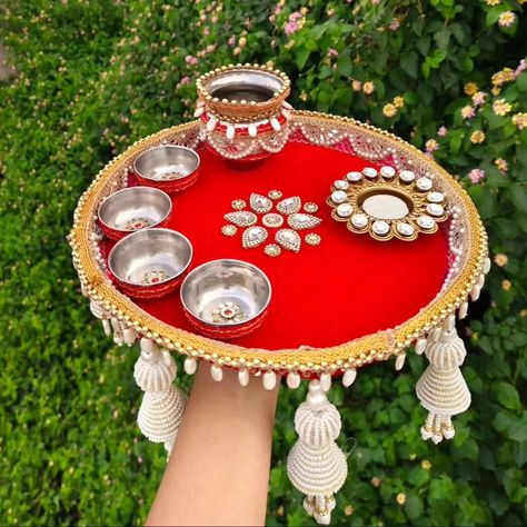 Puja thali on red velvet with kundan Diya 🪔 and pearl Hanging 🥰 DM us for more details or WhatsApp us on 9867422790 Thali Decoration Ideas For Diwali, Puja Thali Decoration Ideas, Puja Thali Decoration, Pooja Thali Decoration Ideas, Thalposh Design, Janmashtami Special, Coconut Decoration, Puja Thali, Thali Decoration