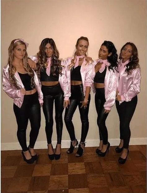 Pink Ladies from Grease | The best group Halloween costumes for teens girls and cute group Halloween costumes college. If you’re looking for friend group Halloween costumes for work, costumes for 3, costumes for 4, or even costumes for family, you’re in the right place! Find easy girl group Halloween DIY costumes for adults and for teens. There’s large group Halloween costumes, big and small group unique Halloween costumes and so much more! #halloweencostumes #grouphalloweencostumes #cutegrouph Pink Ladies Group Costume, The Pink Ladies Costume, Pink Lady Halloween Costume, Pink Ladies Grease Costume, Pink Costume Ideas, Pink Ladies Halloween Costume, Pink Ladies Halloween Costumes, Pink Ladies Costume, Pink Ladies Halloween