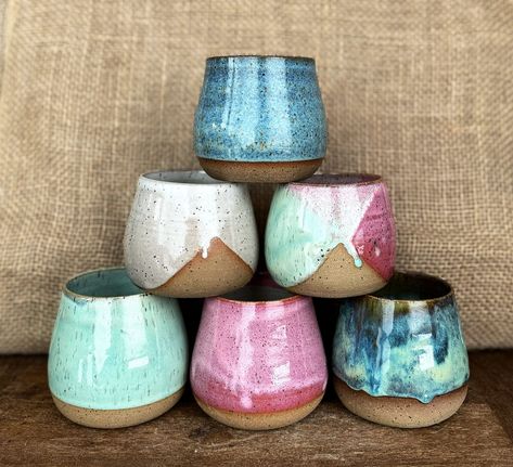 "Ceramic wine cups, wheel thrown. Gorgeous glazes that give the wine drinker such a special experience.  These cuties are such a fun way to sip your favorite beverage. Great for wine, cocktails, coffee and anything in between.   Drinking from a handmade vessel makes the experience a special one.  Hand thrown on the potters wheel with speckled stoneware clay and fired to cone 6. The speckles in the clay peak thru the pink glaze for a beautiful, earthy feel.  Choose from these different sizes:   10 oz 12 oz 14 oz These beautiful cups are handmade. Each cup varies a bit (size, shape, glaze) If you would like to make a \"set\" please reach out and I can pick ones that go nicely together.  Dishwasher and microwave safe. Just use caution if microwave, because pottery does heat up and there's no Pottery Stemless Wine Cups, Ceramic Wine Tumbler, Ceramic Wine Cups, Ceramic Wine Glasses, Ceramic Mugs Handmade, Pottery Wine Cups, Japanese Diy, Cup Pottery, Beautiful Cups