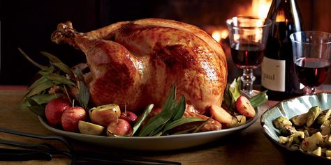 In this turkey recipe, chef Michael Symon glazes his luscious Thanksgiving turkey with cider-and-sage butter and serves it with beer-spiked gravy. Best Thanksgiving Turkey Recipe, Food Thanksgiving, Michael Symon, Turkey Glaze, Cooking With Beer, Turkey Recipes Thanksgiving, Turkey Gravy, Turkey Recipe, Beer Recipes