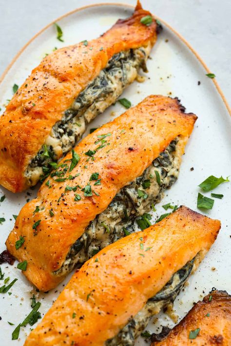 This spinach stuffed salmon is a flavor explosion, with the creamy richness of the cheese and the earthy goodness of the spinach perfectly complementing the tender, flaky salmon. It's a restaurant-quality meal that's ready in just 45 minutes! Spinach Stuffed Salmon, Stuffed Salmon Recipe, Stuffed Salmon, The Recipe Critic, Recipe Critic, Salmon Dinner, Easy Seafood Recipes, Salmon Recipe, Incredible Recipes