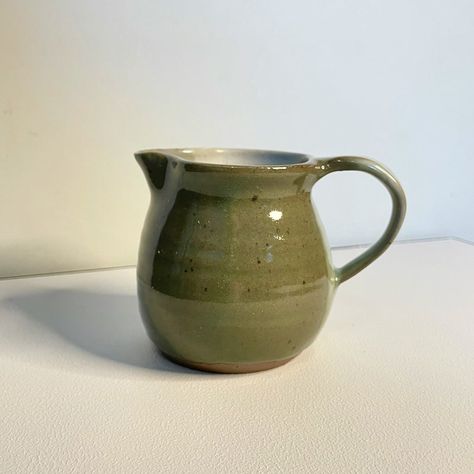 Very cool original piece of pottery handmade by studio artist. Pitcher is signed on the bottom by artist "A Schmidt" and is a very cool variety of gray colors, a perfect neutral.    MEASURMENTS  Height: 4 inches  Mouth Width: 3 inches  Total Width: 5 inches    CONDITION REPORT  Pottery pitcher is in excellent condition, showing no noticeable flaws Pinch Tea Pot, Farmhouse Ceramics, Natural Pottery, No Wheel Pottery, Pitcher Pottery, Ceramics Ideas Pottery Wheel, Pottery Collection, Pottery Pot Ideas, Wheelthrowing Pottery Ideas