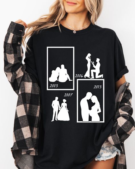 Celebrate the milestones of your relationship with this customizable couple T-shirt, from the first meeting, proposal, wedding, and pregnancy. Perfect for couples looking to commemorate their journey together. You can customize it by putting the dates for every milestone(first meeting, proposal, wedding, and first pregnancy). You can enter the dates in the personalization box or you can personally message me on Etsy chat. Please note that any accessories or pants in the mock-ups are not included in the sale. The shirt is the only item for sale.  This is a print-on-demand product, meaning it will only be made after your order. Because of this, we don't accept returns or exchanges.  Carefully check our color and size charts before you place your order and allow for production time. Please no Memory Shirt, Married Shirt, Memory Shirts, Proposal Wedding, Anniversary Shirt, First Meeting, Matching Couple Shirts, Couple Shirt, First Pregnancy