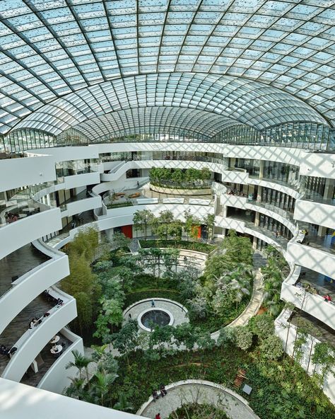 The Albert Einstein Education and Research Center (AEERC) in São Paulo, Brazil was designed as an urban oasis, integrating laboratory spaces, classrooms, and communal areas around a vaulted, skylit atrium garden. The central garden serves as a hub for interaction, collaboration, and relaxation, visible from nearly every part of the building. AEERC, adjacent to Hospital Israelita Albert Einstein, is a significant project by the Sociedade Beneficente Israelita Brasileira Albert Einstein, markin... Atrium Garden, Exhibition Building, Research Center, Urban Oasis, Street Furniture, Research Centre, Feeling Blue, Futuristic Architecture, Albert Einstein