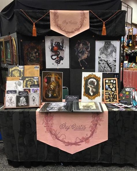 Shy Custis on Instagram: "Day 2 at @gen_con, table 81 in the art show! ✨ A new specialty item is debuting at the show before going live on the shop. Can you spot them? 👀 Patreon subscribers already got the first look & will get first dibs once they’re online! Patreon.com/ShyCustis" Vending Table Set Up, Fair Table Display Ideas, Art Market Booth, Art Market Display, Art Festival Booth Display, Festival Booth Display, Art Festival Booth, Convention Booth, Art Booth