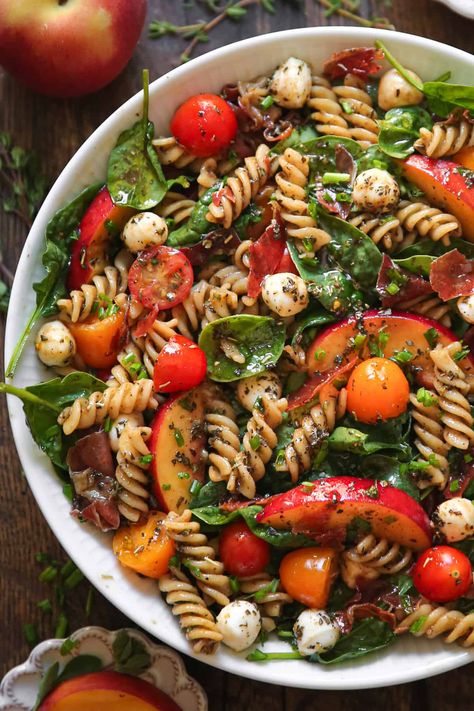 Summer Pasta Salad with Peaches, Spinach, Tomatoes, and Mozzarella Cheese in a bowl Peach Pasta Salad, Salad With Peaches, Pasta Salad With Spinach, Tomatoes And Mozzarella, Fresh Recipe, Dried Peaches, Fresh Summer Salad, Caprese Pasta, Mozzarella Salad