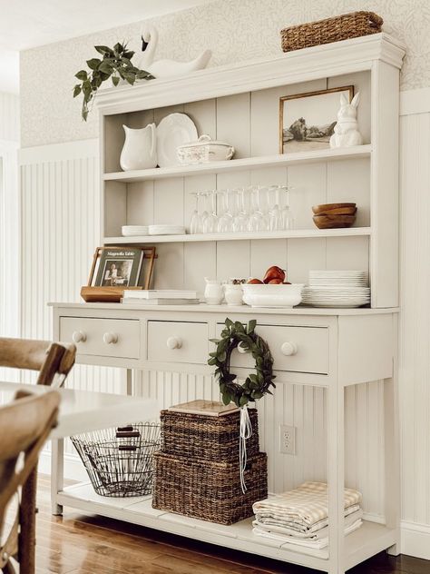 Discover how to decorate a kitchen hutch with these cozy styling tips to infuse your kitchen with personality, warmth, and coziness. Antique China Cabinet Decor, Decorate Hutch For Christmas, How To Style China Cabinet, Dining Hutch Styling, Dining Hutch Decor, Kitchen Hutch Decorating Ideas, Hutch In Dining Room, Top Of Hutch Decor, How To Decorate A Hutch