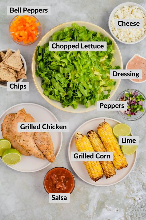 Sometimes Caesar salad can sound bland; but why not spice it up a notch by making this Mexican Caesar Salad - it’s a fiesta in your mouth! With salsa, caesar dressing, summer grilled corn on the cob, tender, juicy chicken, crunchy tortilla chips, this salad does NOT lack in flavor. Salad With Chips, Mexican Caesar Salad, Grilled Corn Salsa, Grilled Chicken Strips, Grilled Corn On The Cob, Caesar Salad Dressing, Cheese Stuffed Peppers, Chicken Caesar, Chicken Caesar Salad