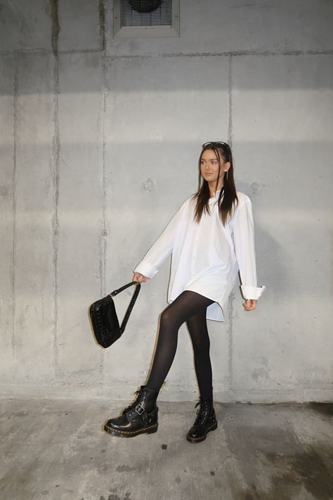 leg poses, instagram poses, posing ideas, white shirt dress, white shirt outfit, doc martens outfit, tights outfit ideas, instagrammer #instagramtips #instagram #ootd #ootdfashion #pinterest #docmartensoutfits #carpark #instagrampostideas White Shirt And Tights Outfit, White Dress With Doc Martens, Oversized Shirt And Tights, Dresses With Doc Martens Outfits, Car Park Photoshoot, Oversized Button Down Shirt Outfit, White Socks Outfit, Tights Outfit Ideas, Outfit With Tights