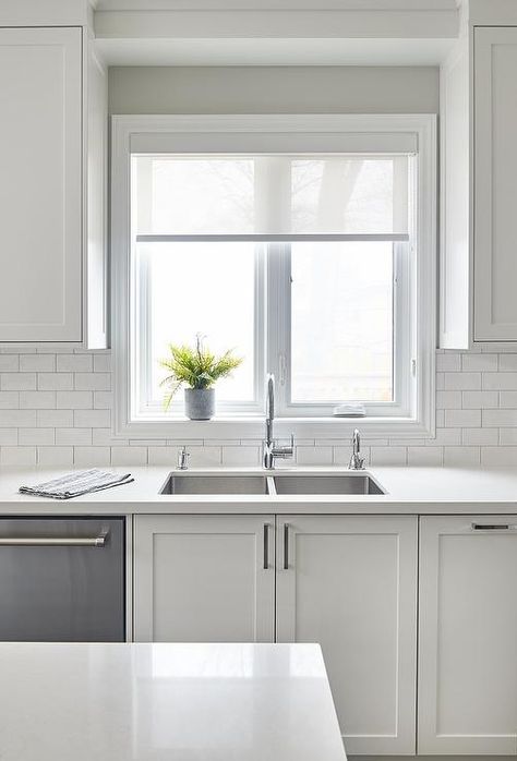 White subway tiles with light gray grout in kitchen featuring white shaker cabinets, nickel pulls and a stainless steel dual sink with a gooseneck faucet. Kitchen Design Grey And White, Light Gray Grout, Gray Kitchens, Gray Grout, White Wood Paneling, Window Views, Fireplace Update, Gray And White Kitchen, White Shaker Cabinets