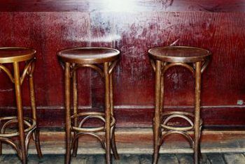 Ryan McVay/Photodisc/Getty Images Stool Photography, Bar Stool Cushions, Pub Stools, Tall Stools, Bar Stool Seats, Stool Cushion, Home Bar Furniture, Comfortable Place, Dive Bar