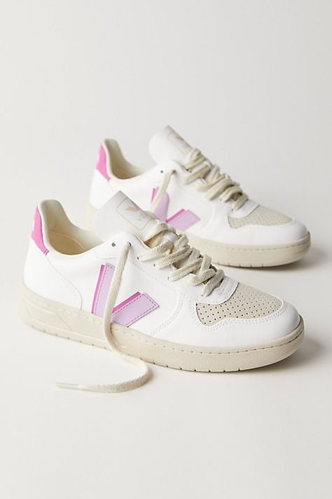 Made from sustainable materials, these retro-style leather sneakers feature colorful details and a logo on the side. * Padded collar and footbed * Low-top style * Textured rubber sole **VEJA** VEJA sneakers are made using fair trade principles and are composed of raw and wild materials sourced from organic farming and ecological agriculture, without chemicals or pollutants. They work directly with the Seringueiro community in the Amazon Rainforest to harvest wild rubber, which is used in the sole of every VEJA sneaker. Each pair of VEJA sneakers is produced in the same factory in the state of Rio Grande do Sul in southern Brazil. | Veja V-10 Sneakers at Free People in Purple, Size: EU 39 Organization Shoes, Shoes Dressing, Dressing Shoes, Shoe Outfits, Shoe Organization, Shoes Dresses, Trends Shoes, Veja V 10, Shoes Storage