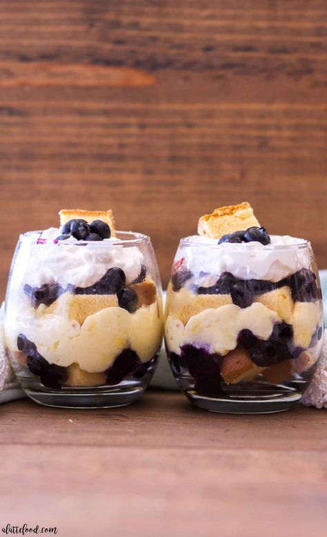 two no bake blueberry lemon pound cake trifles in jars Trifle With Pound Cake, Easy Lemon Pudding, Lemon Blueberry Parfait, Pound Cake Trifle, Mini Trifle Desserts, Blueberry Lemon Pound Cake, Lemon Blueberry Trifle, Lemon Trifle, Blueberry Trifle