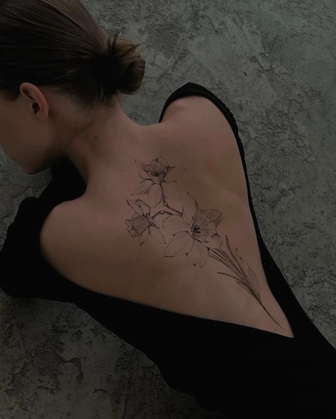 Linework Back Tattoo Women, Mixed Flower Tattoo Half Sleeves, Flower Buds Tattoo, Wild Flower Back Tattoo, Leg Tattoos Women Flower, Night Blooming Jasmine Tattoo, Daffodil Back Tattoo, Flower On Back Tattoo, Plant Spine Tattoo