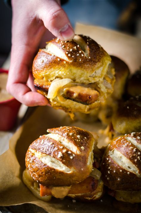 Bratwurst Sliders, Braised Onions, Octoberfest Party, Pretzel Buns, Bratwurst Recipes, Sweet Songs, Happy Hour Food, Pretzel Rolls, Pretzel Bun