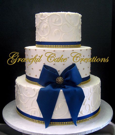 https://flic.kr/p/QPeRpc | Elegant Ivory Butter Cream Wedding Cake with Gold Sugar Pearls and Navy Blue Ribbon and Bow with Gold Bling Blue And Gold Wedding Cake, Wedding Cake Elegant Gold, Blue And Gold Cake, Royal Blue Wedding Cakes, Navy Blue Wedding Cakes, Blue And Gold Wedding, Cream Wedding Cakes, Wedding Cake Navy, Wedding Cakes Elegant