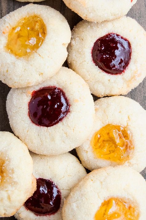 The best, classic, old fashioned, easy jam thumbprint cookies recipe from scratch, homemade with simple ingredients. Soft and tender sugar cookies are indented in the center and filled with jam! Perfect for the Christmas holidays! Also known as jam thumbprints or jam drops. Christmas is the time to give and spend time with the family. One thing that people do during the holidays is bake desserts. Today's recipe will be a good addition to your baking list along with these Chocolate Thumbprint Coo Jam Thumbprint Cookies Recipe, Thumbprint Cookies With Icing, Jam Thumbprints, Jam Drops, Thumbprint Cookies Easy, Raspberry Thumbprint Cookies, Jam Thumbprint Cookies, Easy Jam, Salty Cookies