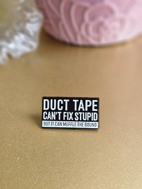 Funny Enamel Pin. Pin says "Duct Tape Can't Fix Stupid But It Can Muffle The Sound" Approximately 1.25 inches Funny Enamel Pins, Stuff You Need, Funny Badges, Enamel Pin Backpack, Pin Backpack, Pin Enamel, Pin Pin, Take My Money, Sarcastic Quotes Funny