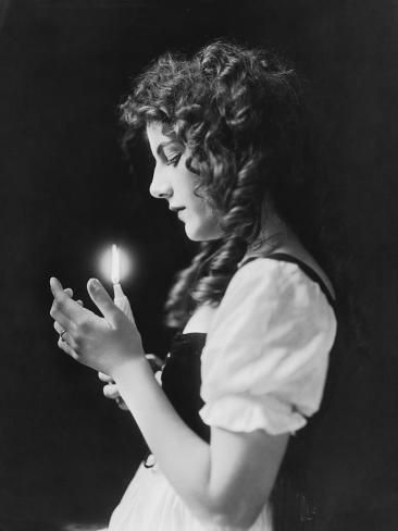 Portrait With Candle, Woman Holding Something Pose, Woman Looking Down At Her Hands, Thinking Woman Photography, Looking Down Holding Something Pose, Holding Candle Pose Reference, People Holding Things Reference, Woman With Candle Photography, Woman Holding Orb