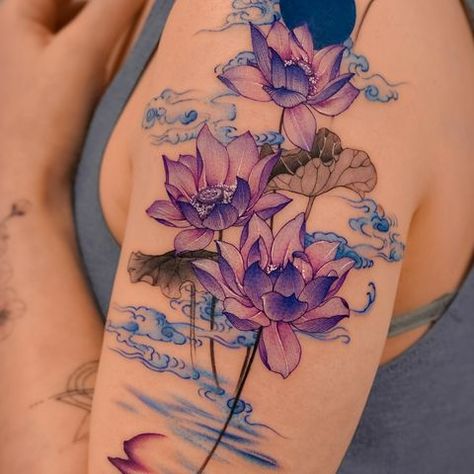 𝗘.𝗻𝗮𝗹 (@e.nal.tattoo) • Instagram photos and videos Purple Tattoo Ink, Delphinium Tattoo, Purple Water Lily, Water Lily Tattoo, Flower Cover Up Tattoos, Lily Tattoos, Water Lily Tattoos, Purple Water, Paper Bird